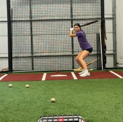 Softball hitter in the cage